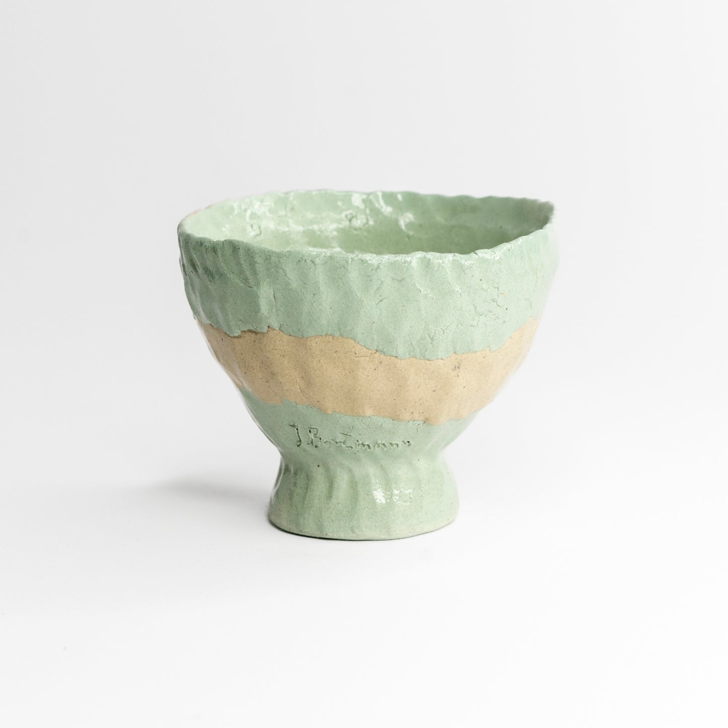 Blue and grey coloured clay cup