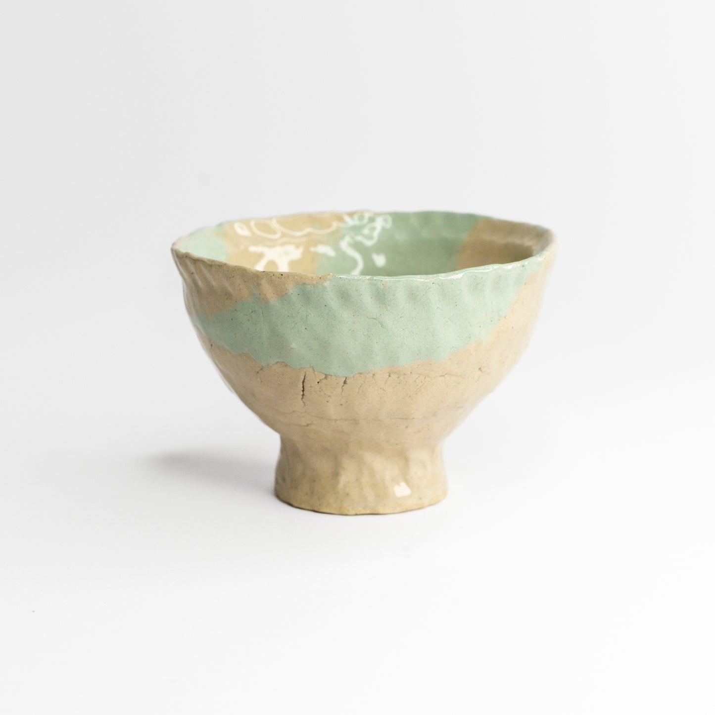 Blue and grey coloured clay cup